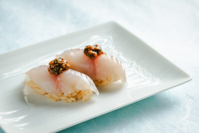 発酵と熟成がテーマの日本料理レストラン GINZA 豉 KUKI 6月コースのご案内 水無月豆腐ととうもろこしに『CRAFT MISO 生糀』を合わせたすり流しや 鯵の握りなど、厳選した旬の食材を使用した料理を提供